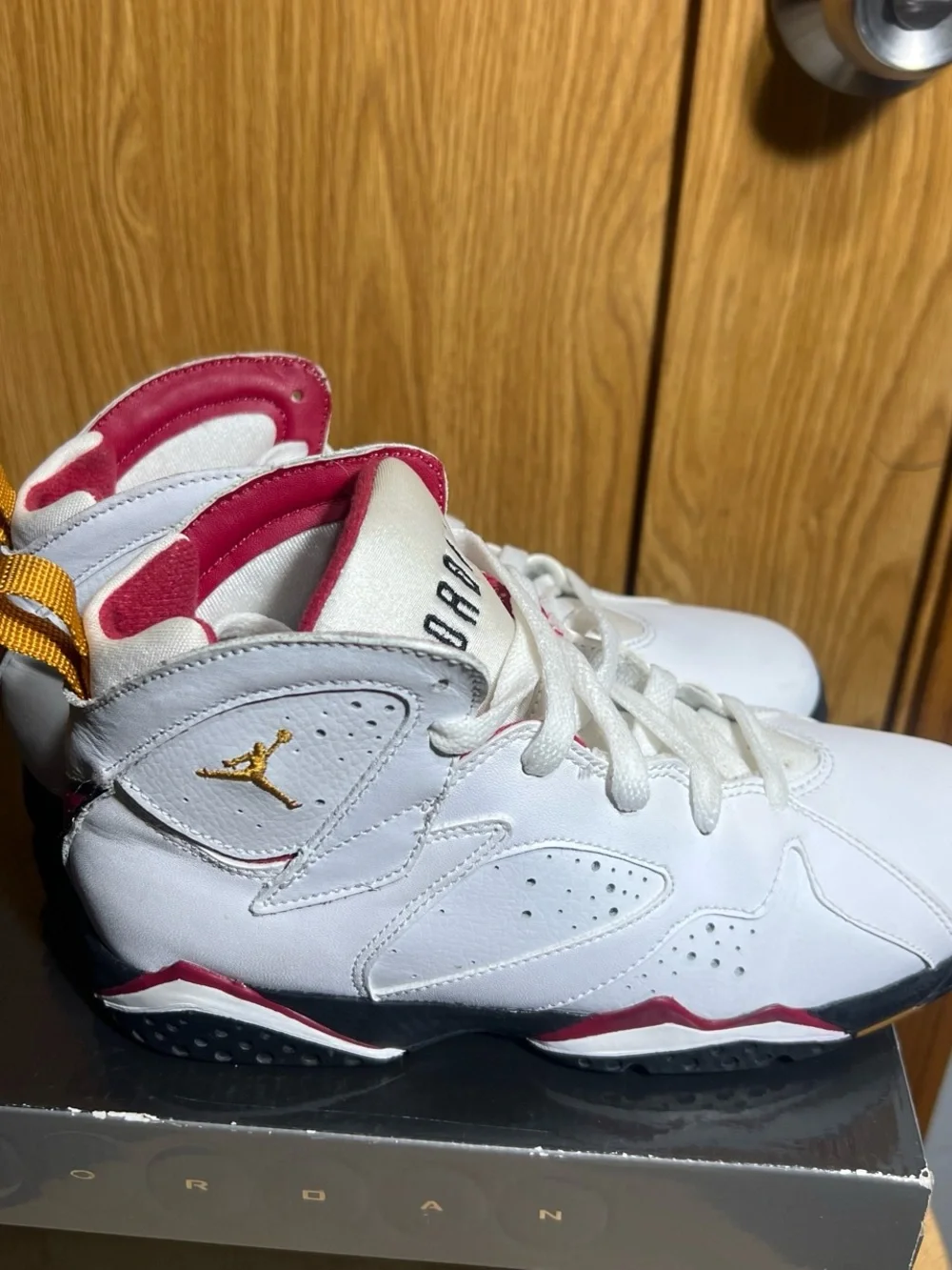 Jordan Kids White High-Top Sneakers with Pink Lining and Yellow Heel Tabs